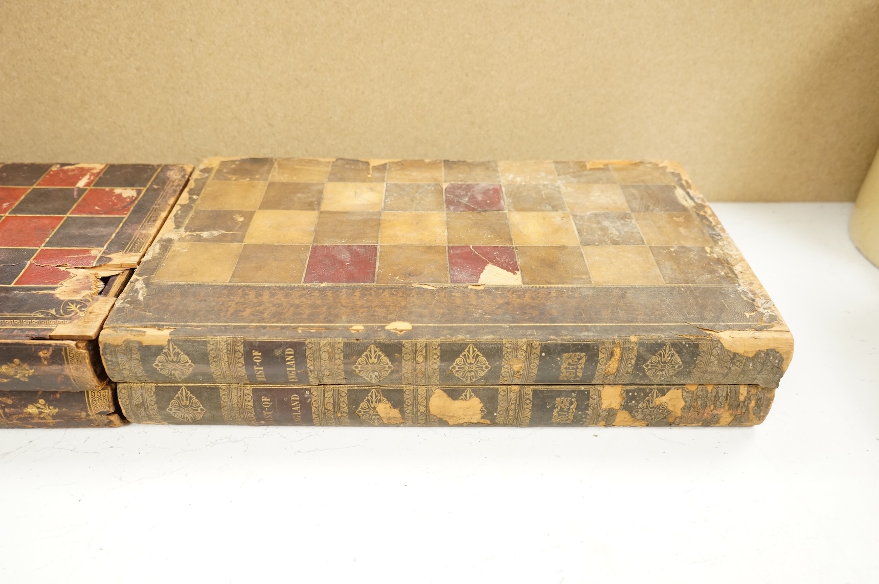 Three folding chess and backgammon boards in the form of books, 42cm
